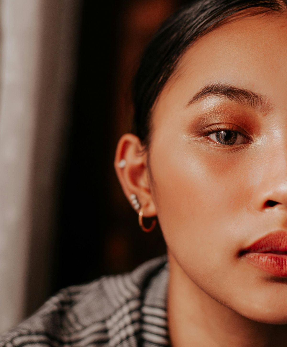 Close-up of a Farmington ear reshaping model face with makeup.