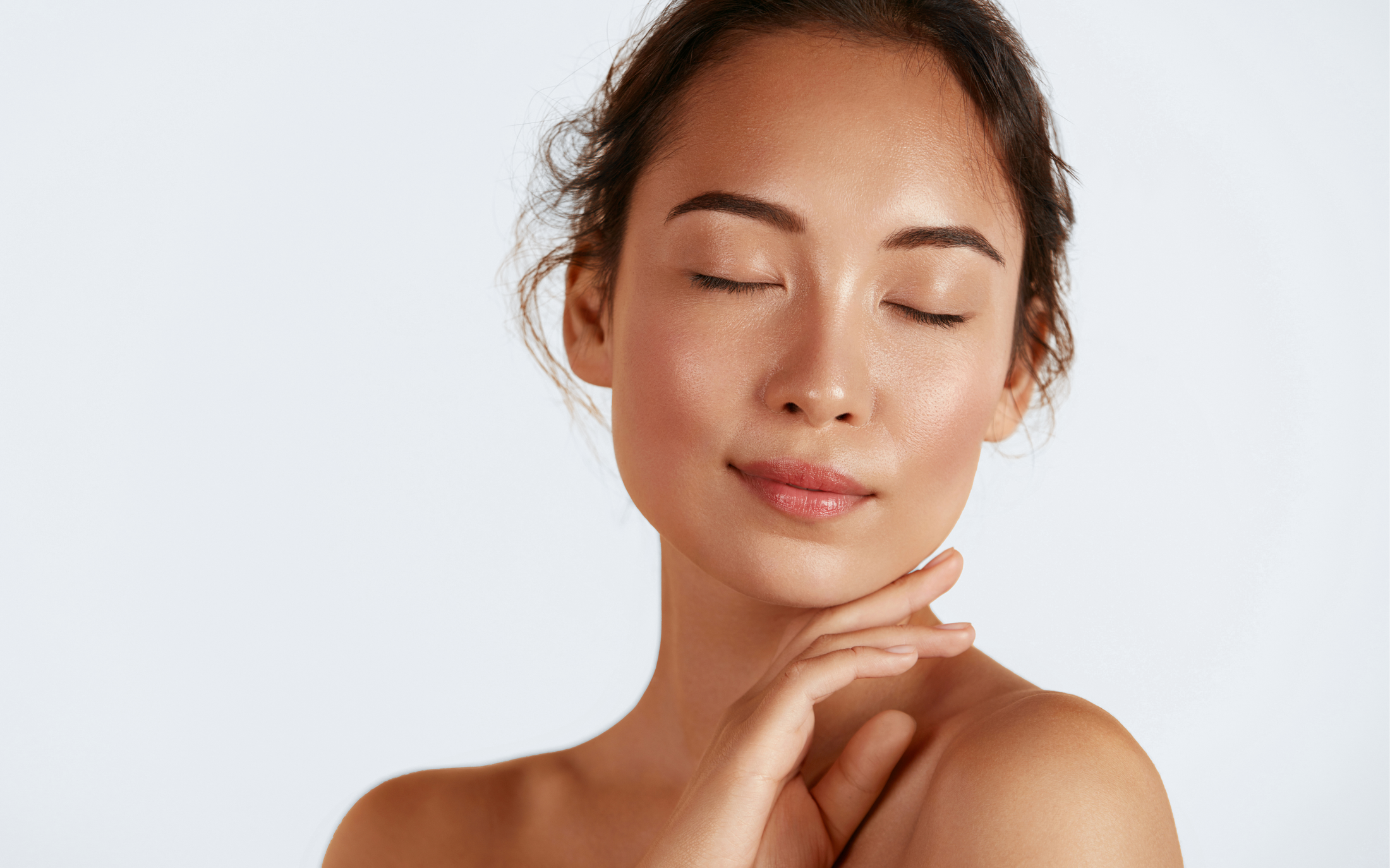 Avon skincare model with closed eyes and serene expression.